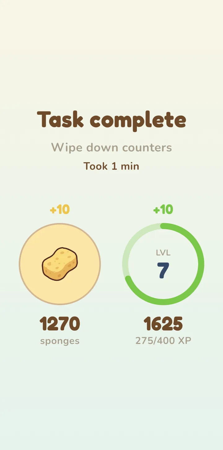 The Task complete screen for Wipe down counters: +10 sponges and +10 XP.